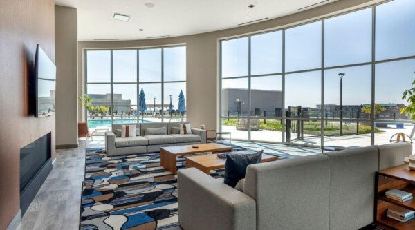 Lounge space at Escape at Harbor Point by Compass Furnished Apartments.
