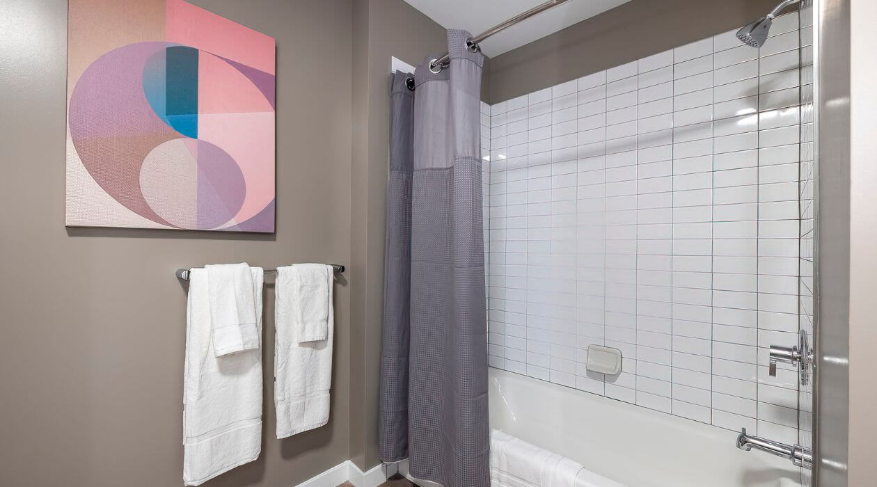 Modern bathroom at Escape at Harbor Point, maintained by Compass Furnished Apartments.