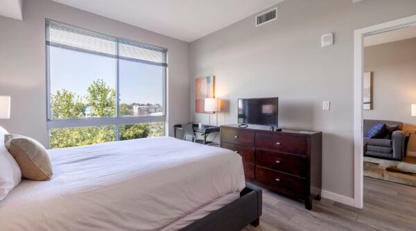 Contemporary bedroom at Escape at Harbor Point by Compass Furnished Apartments