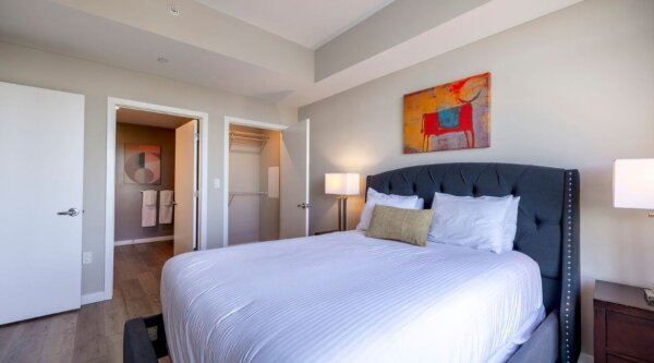Modern bedroom at Escape at Harbor Point by Compass Furnished Apartments