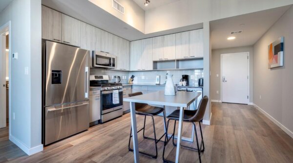 Modern kitchen area at Escape at Harbor Point by Compass Furnished Apartments