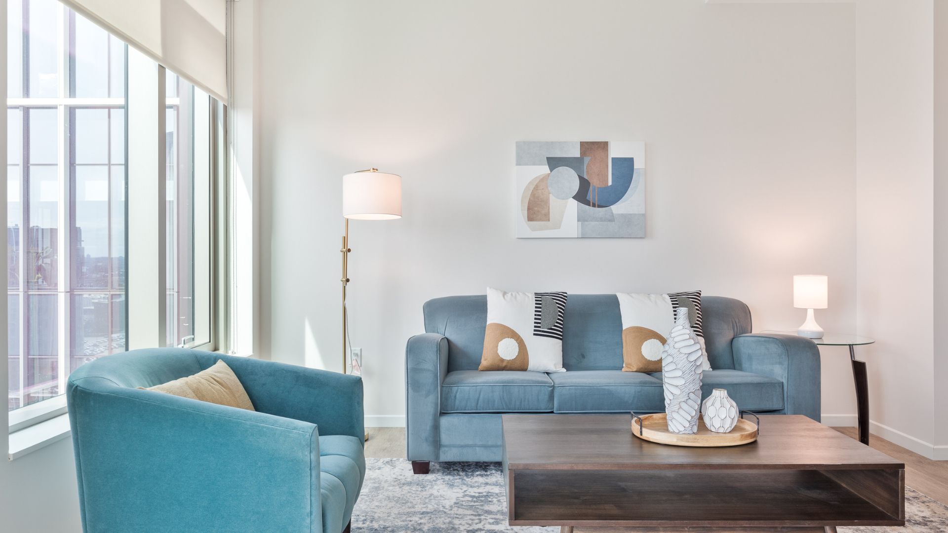 Modern living room at The Alyx at EchelonSeaport by Compass Furnished Apartments.