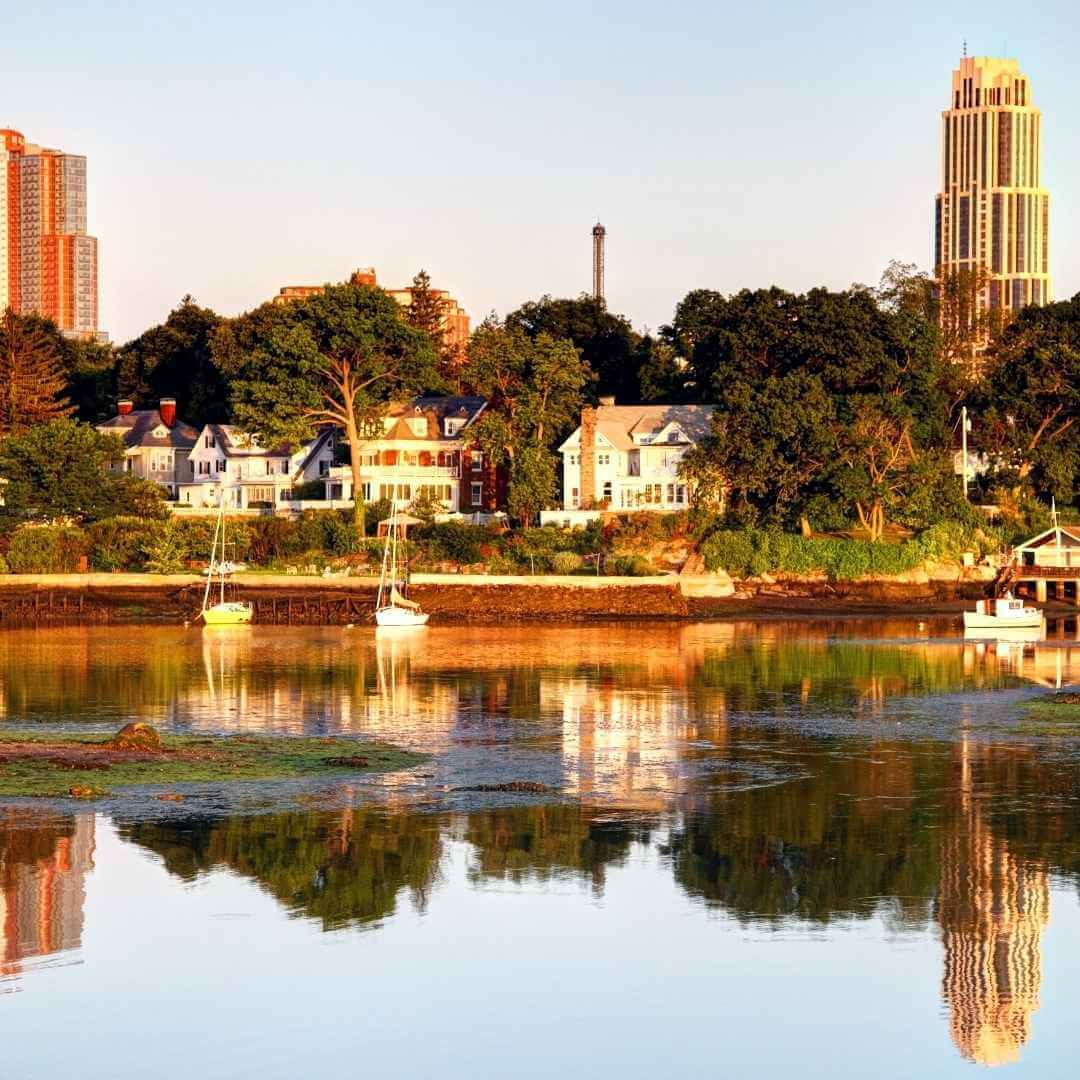 New Rochelle buildings along the waterfront with moored boats