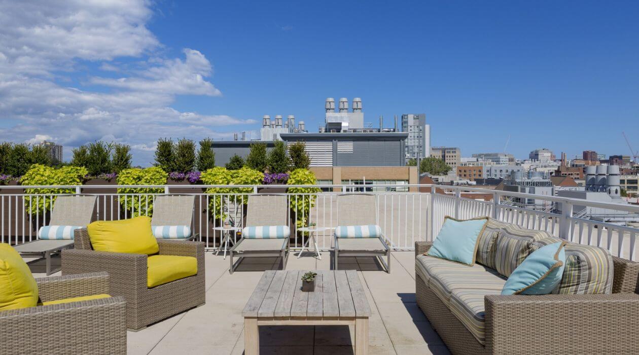 Rooftop lounge at Compass Furnished Apartments' Chroma property