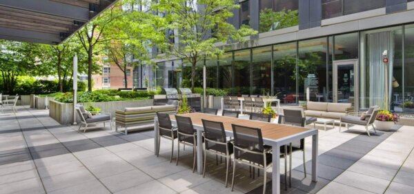Outdoor courtyard lounge at State & Chestnut, a Compass Furnished Apartments property 1
