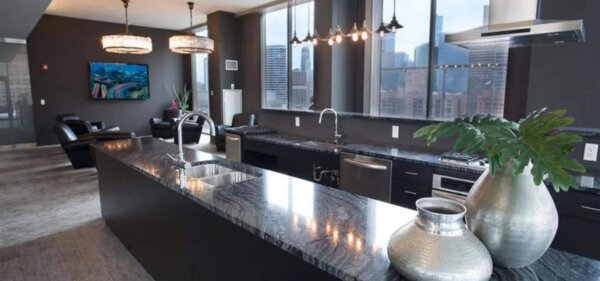 Modern kitchen and lounge area at Catalyst in Chicago, a Compass Furnished Apartments property