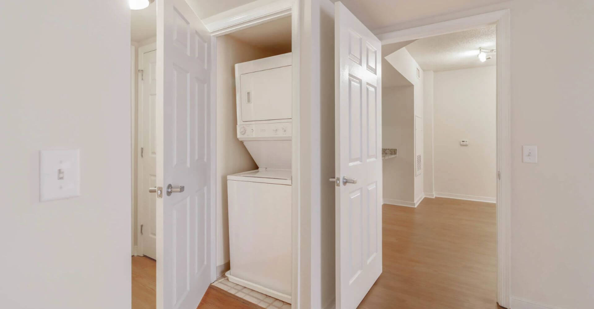 Compact in-unit washer and dryer at 2400 M by Compass Furnished Apartments