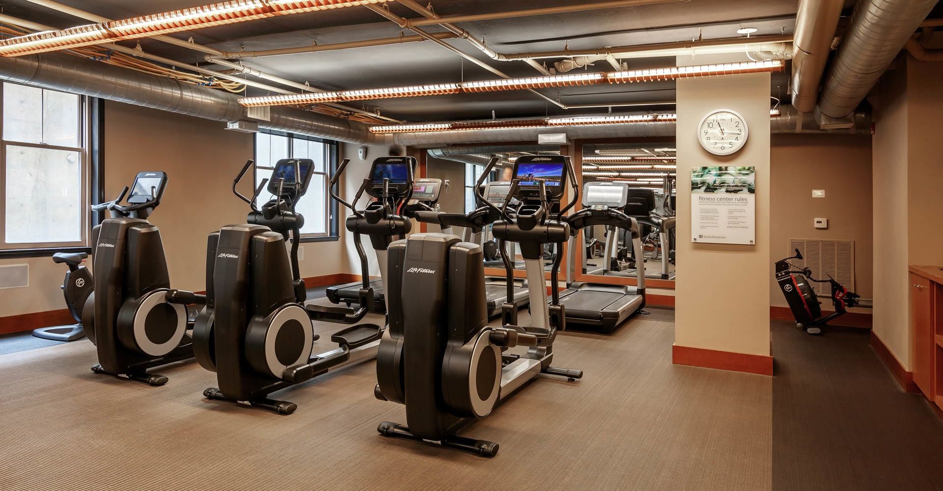 Fitness center at 2400 M by Compass Furnished Apartments