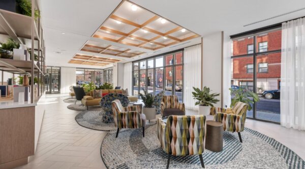 Sun-filled resident lounge at Idyl Fenway by Compass Furnished Apartments