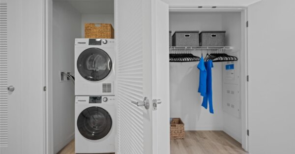 In-unit laundry and organized closet at Idyl Fenway by Compass Furnished Apartments
