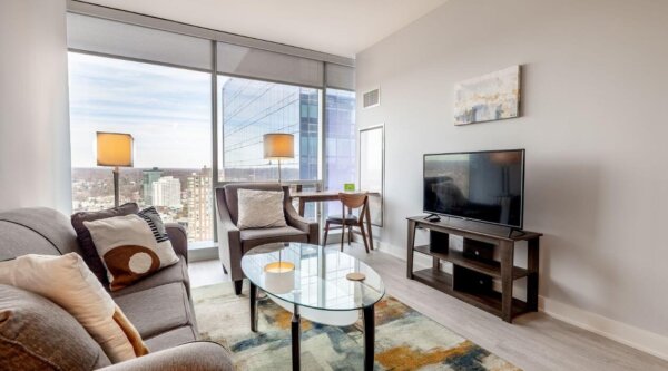 Contemporary living room at 3Thirty3 by Compass Furnished Apartments