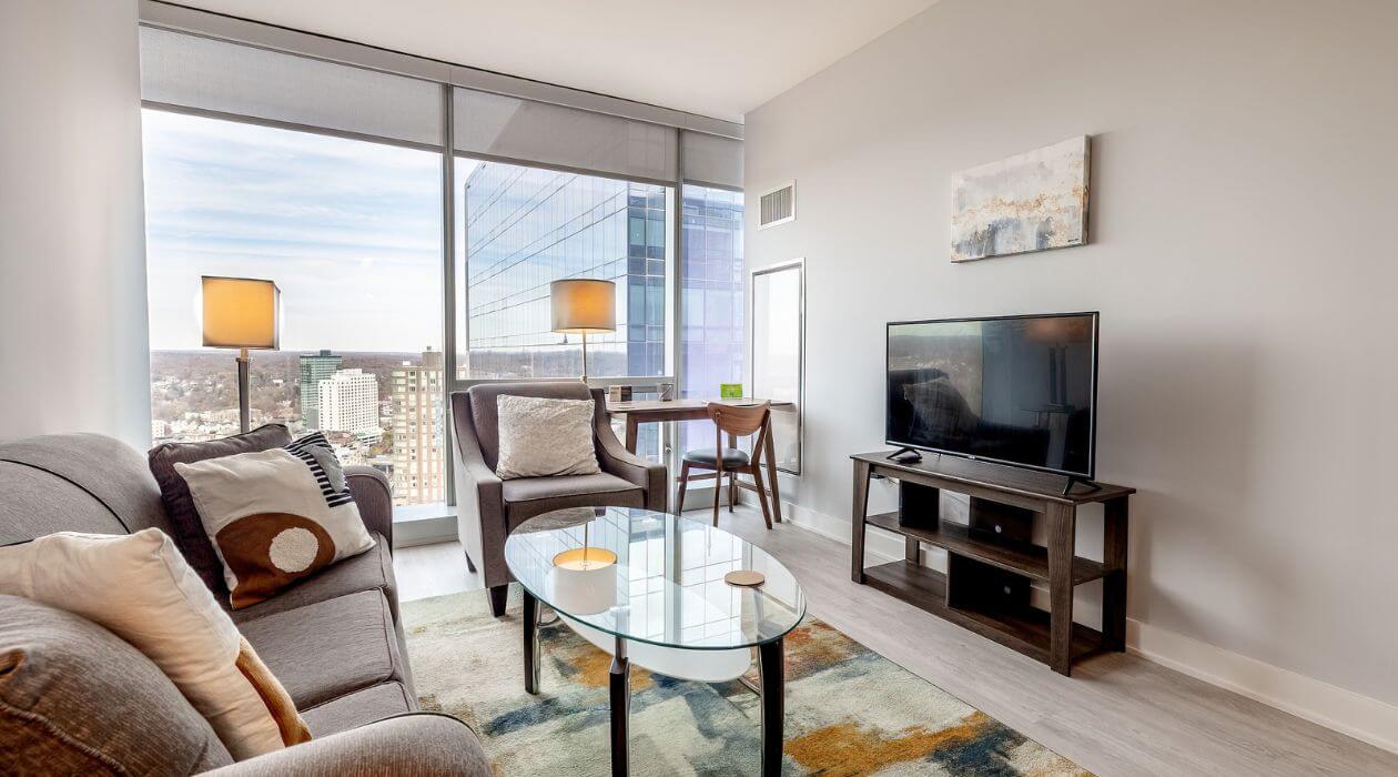 Contemporary living room at 3Thirty3 by Compass Furnished Apartments