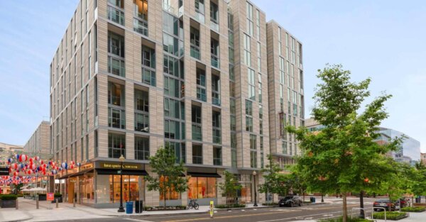 Street-level exterior of The Apartments at CityCenter, part of the Compass Furnished Apartments portfolio.