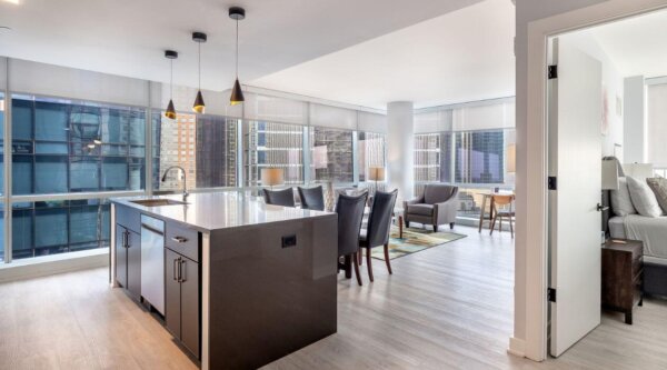 Open-concept kitchen and living area at 3Thirty3 by Compass Furnished Apartments