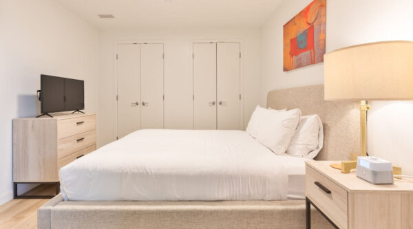 Spacious bedroom at Compass Furnished Apartments in Idyl Fenway