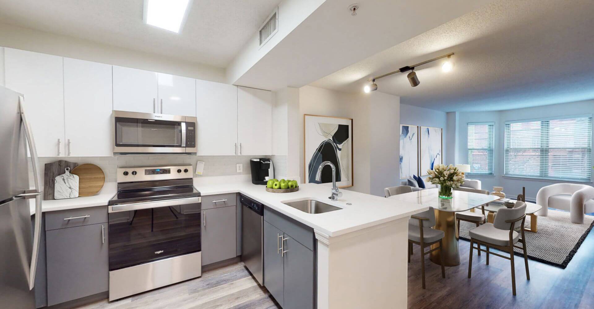 Contemporary kitchen and dining space at Andover House by Compass Furnished Apartments