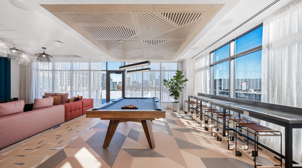 Sleek billiards lounge at Idyl Fenway by Compass Furnished Apartments