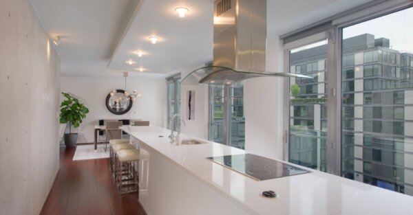 Bright, contemporary kitchen and dining space at The Apartments at CityCenter by Compass Furnished Apartments.