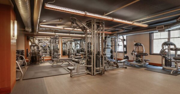 Strength training area at 2400 M by Compass Furnished Apartments