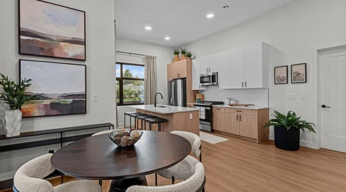 Contemporary Compass Furnished Apartments kitchen and dining area with modern cabinetr