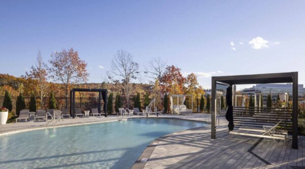 Serene outdoor pool area at The 305 – Compass Furnished Apartments