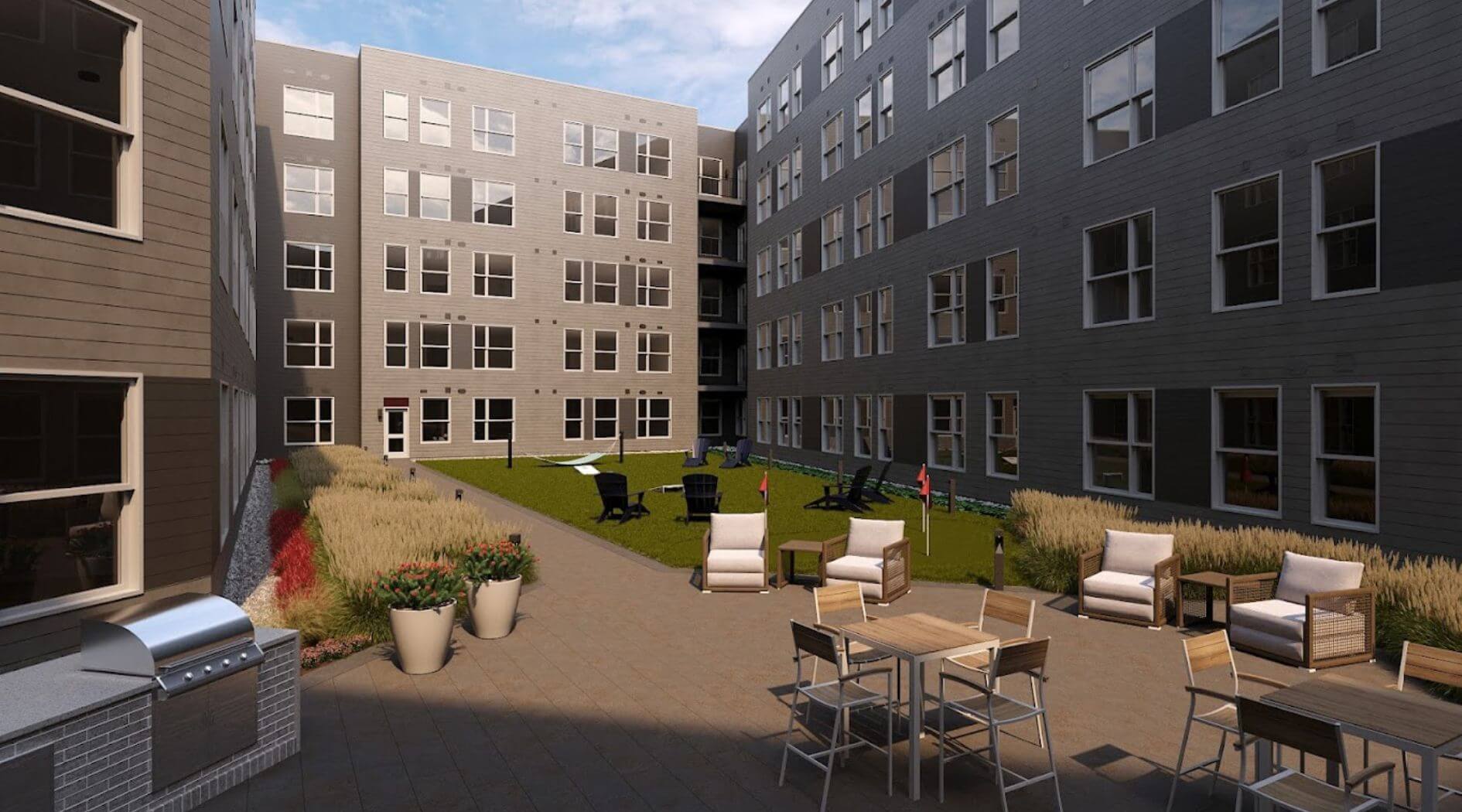 Outdoor courtyard at The 305 – Compass Furnished Apartments.