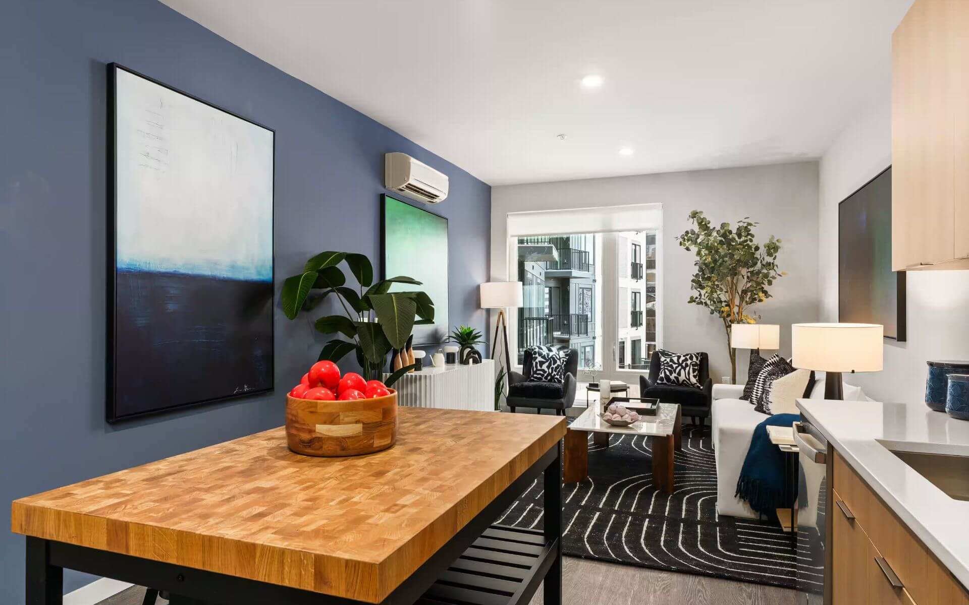 Stylish open-concept living and kitchen area at 51 South by Compass Furnished Apartments