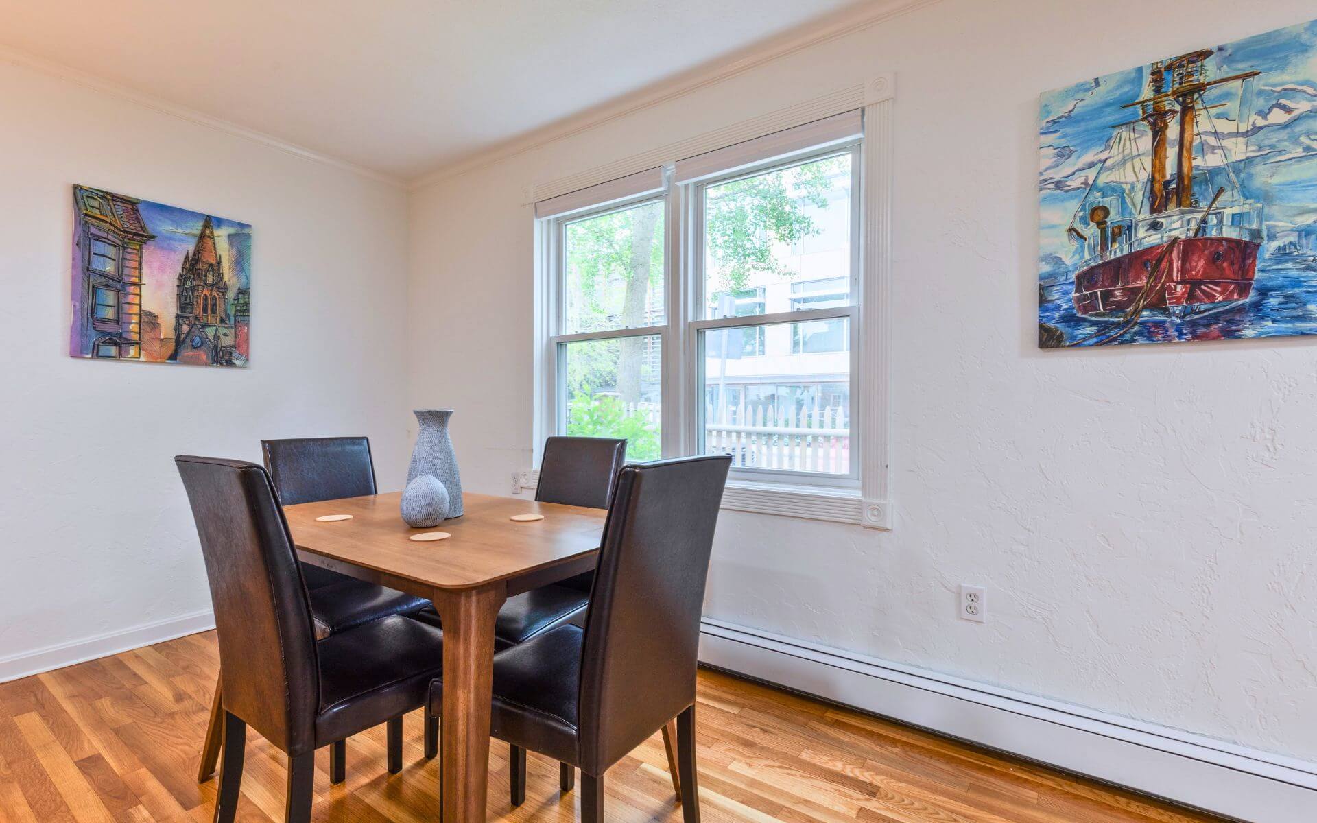 Dining area in a Compass Furnished Apartments unit at 235 Cardinal Medeiros