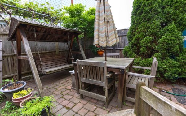 Private brick patio at 235 Cardinal Medeiros by Compass Furnished Apartments