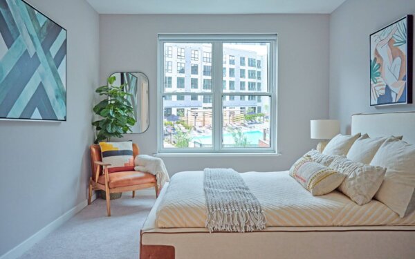 Bright, inviting bedroom at The Pennant at North Crossing by Compass Furnished Apartments