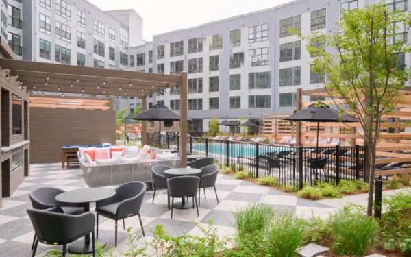 Chic outdoor lounge at The Pennant at North Crossing by Compass Furnished Apartments
