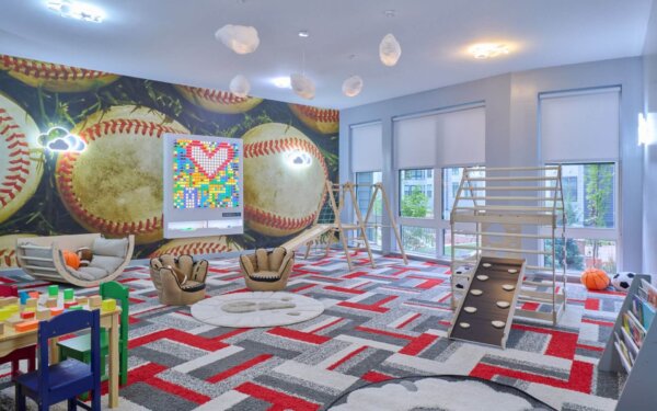 Whimsical children’s playroom at The Pennant at North Crossing by Compass Furnished Apartments