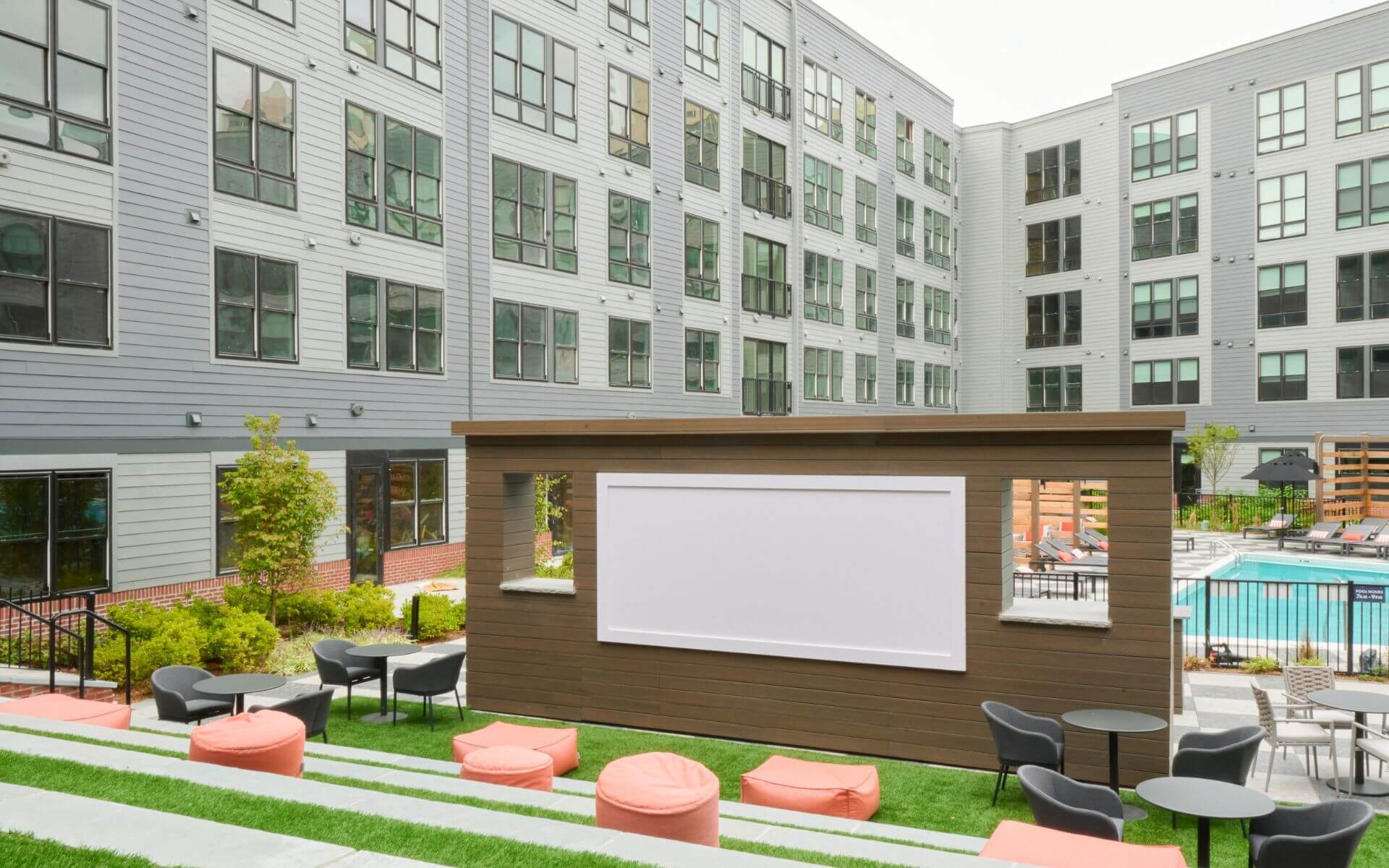 Open-air movie screening area at The Pennant at North Crossing by Compass Furnished Apartments