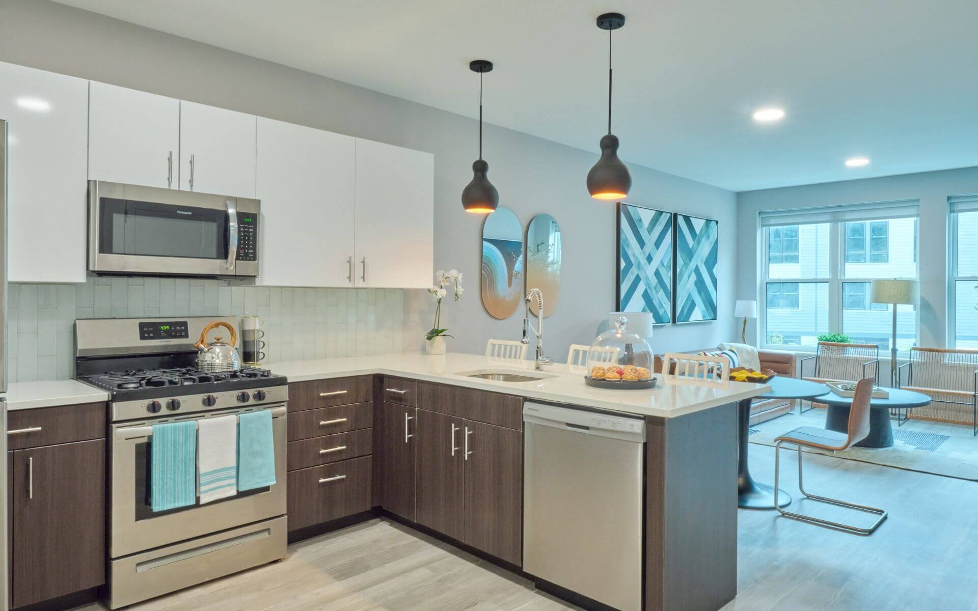 Modern kitchen and living space at The Pennant at North Crossing by Compass Furnished Apartments