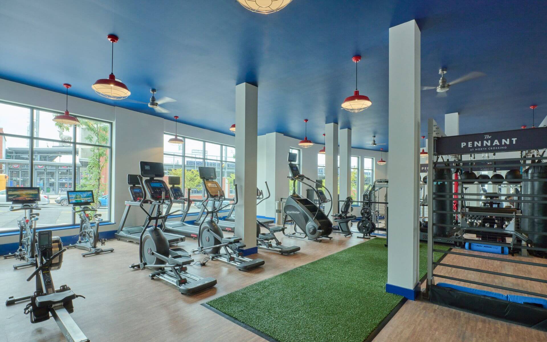 Light-filled fitness center at The Pennant at North Crossing by Compass Furnished Apartments