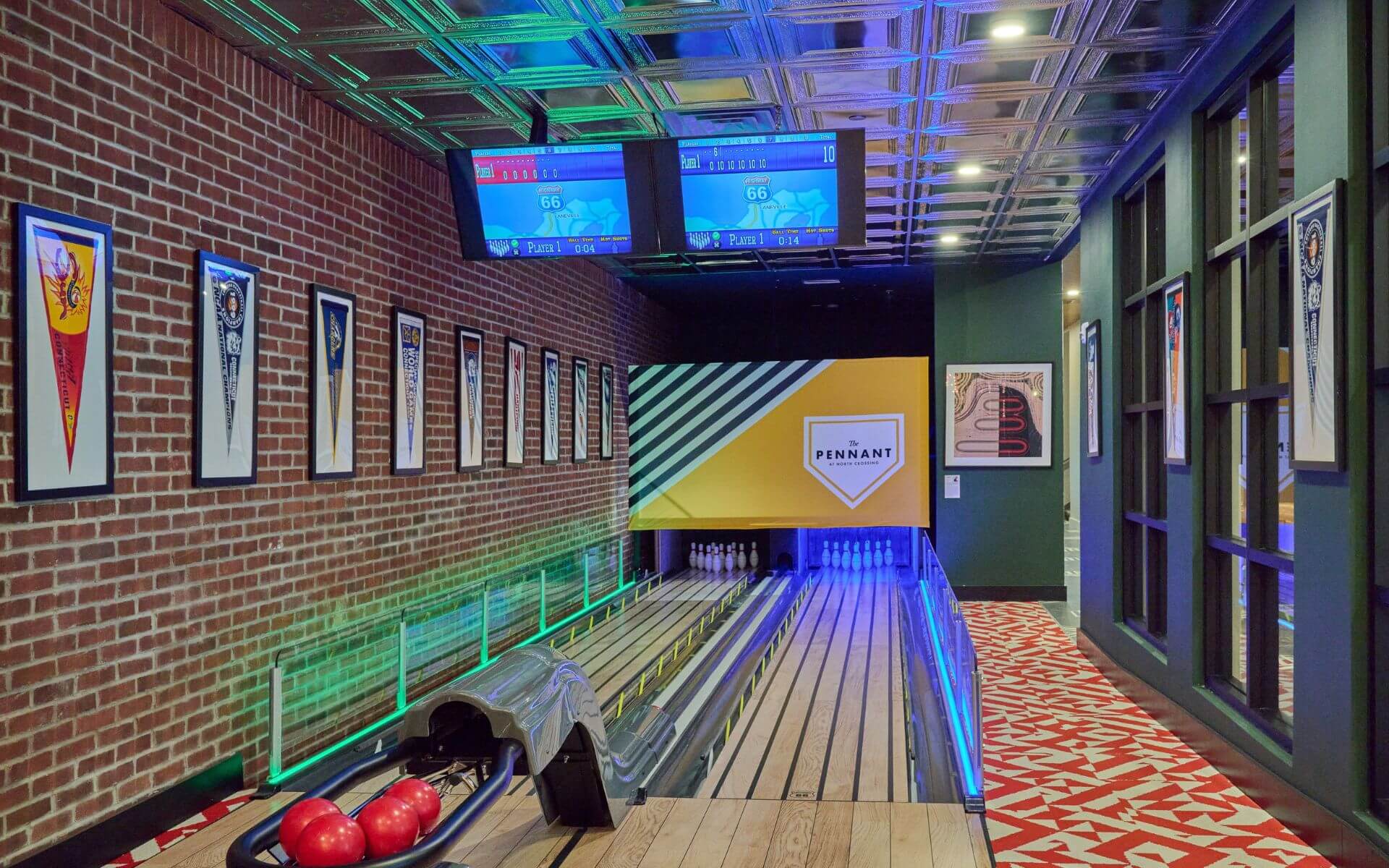 Colorful view of the private bowling lane at The Pennant at North Crossing by Compass Furnished Apartments